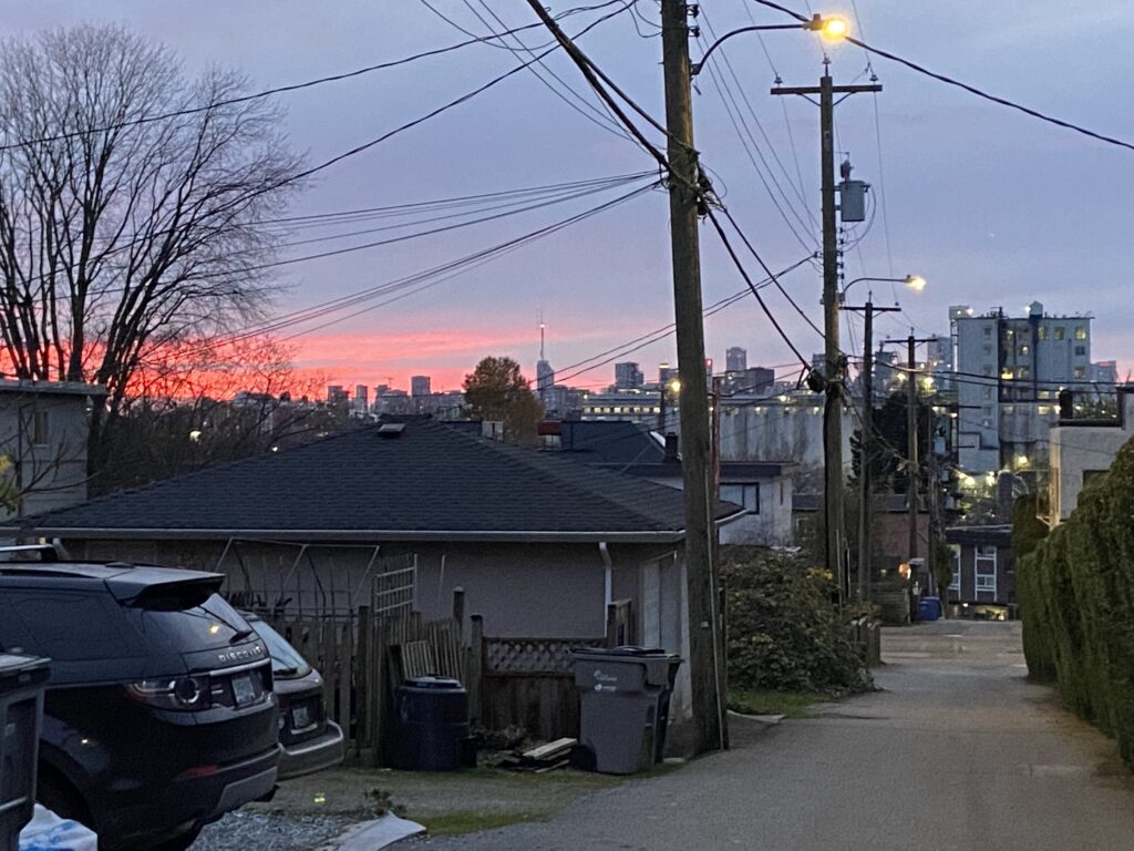 Red sky at dusk taken from a back alley