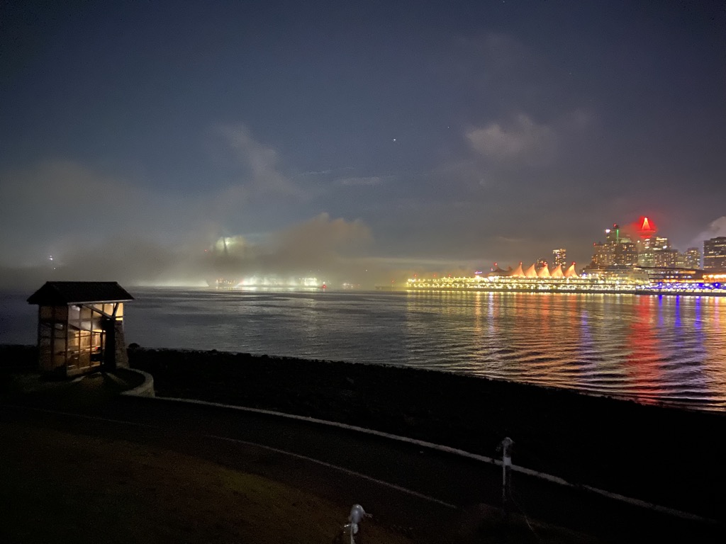 Night view of Nine O'Clock Gun with Vancouver in the background
