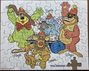 A completed puzzle, with 2 pieces missing, featuring the four main characters from The Banana Splits show.